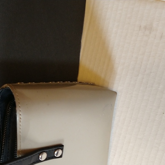 Beijo a pearlized gold color with black straps and trim. - Picture 5 of 14